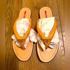 Prada Sport Patent Leather Flip Flops
Neutrals